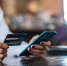 pay-for-goods-by-credit-card-through-a-smartphone-in-a-coffee-shop_1150-18770 - ИА МедиаПоток