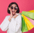 woman-in-casual-white-sweater-and-sunglasses-on-red-wall - ИА МедиаПоток